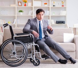 Dsabled businessman on wheelchair working home