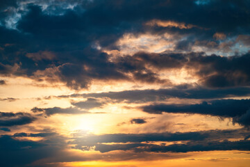 Naklejka na ściany i meble Dramatic sunset cloudy sky with blue clouds as abstract beautiful cloudscape background.
