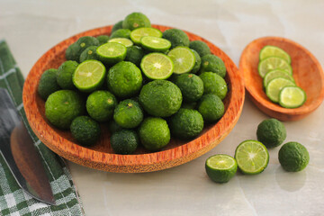 kaffir lime on a coconut wood plate