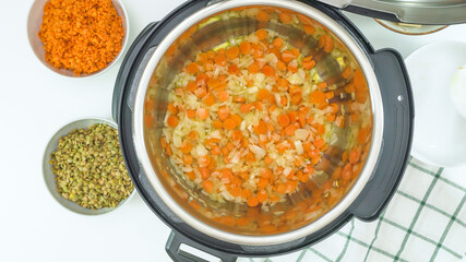 Multi cooker recipe. Cooking vegetables. Saute onion and carrot.