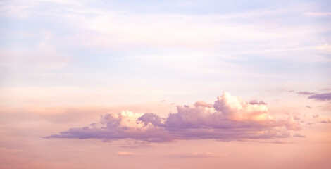 Panorama during sunset over forest with pastel colors sky and colorful clouds