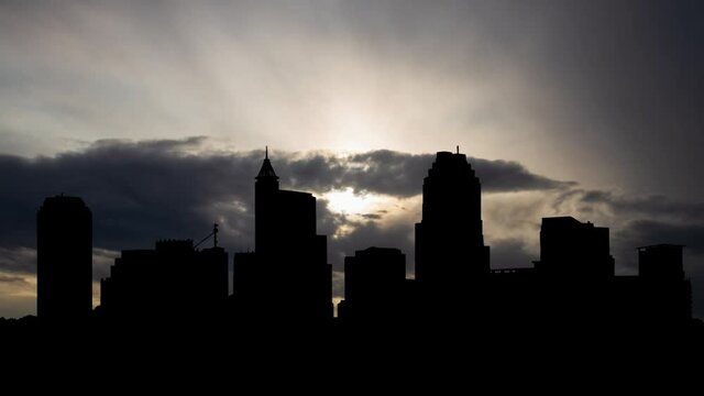 Downtown Raleigh, North Carolina, Time Lapse at Sunrise with Fast Clouds and Dark Silhouette of Skyscrapers