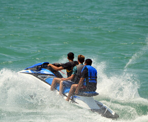 Teenagers Riding Tandem on a Speeding Jet Ski