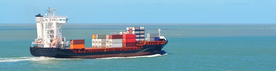 Foto op Plexiglas Large container ship sailing from the port of Antwerp. Vlissingen, the Netherlands. Freight transportation, nautical vessel, logistics, industry, commerce, environment. Panoramic view, copy space © Aastels