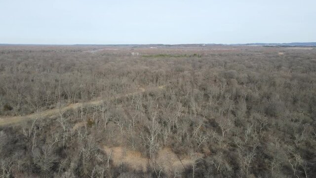 A gorgeous aerial 4K shot of the Cranes Bend in Durand, Wisconsin along the Chippewa river - leafless forest