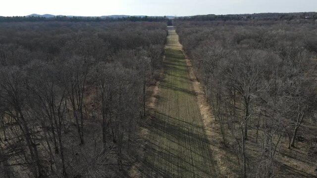 A beautiful aerial 4K shot of the Cranes Bend in Durand, Wisconsin along the Chippewa river - leafless forest