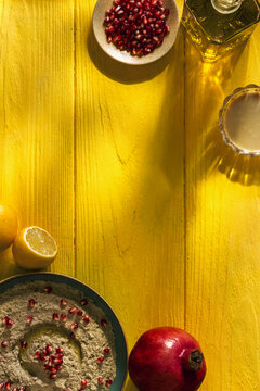 Baba ganoush or mutabal, Middle Eastern eggplant dip sauce garnished with pomegranate seeds, with various ingredients