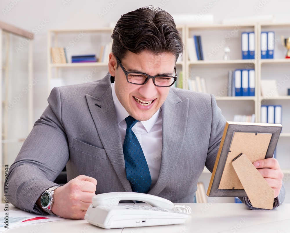 Wall mural businessman looking at the picture frame