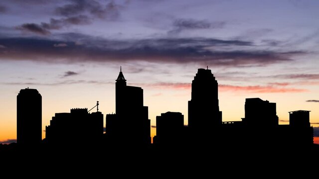 Raleigh Skyline, North Carolina, Time Lapse at Twilight with Colourful Sky and Dark Silhouette of Skyscrapers, USA