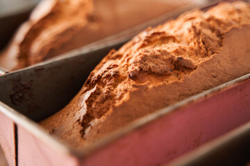 Bakeware with fresh cakes standing at the table and preparing for the salling