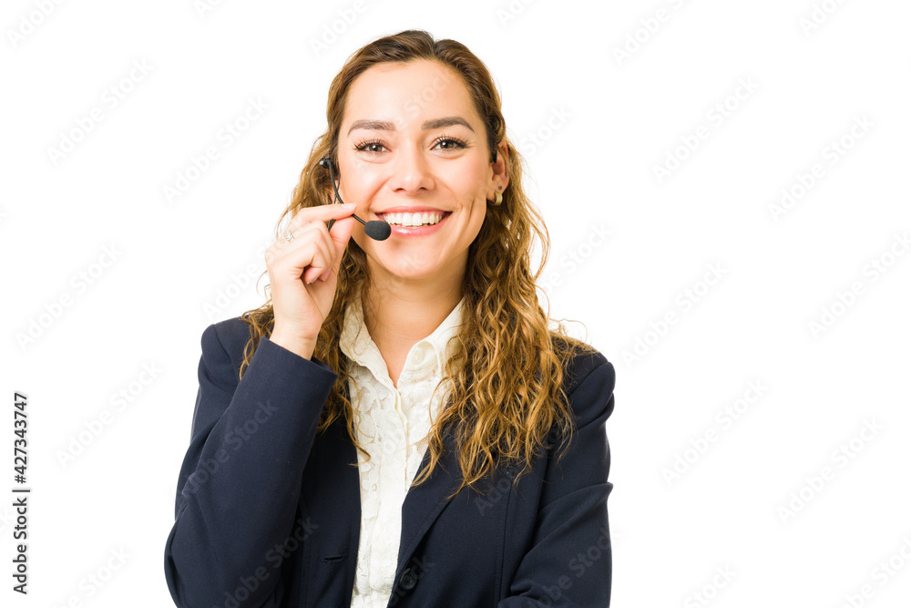 Wall mural Excited professional woman speaking to a client on the phone