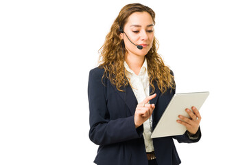 Beautiful woman working as a salesperson with a tablet
