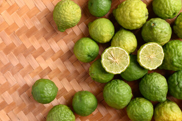 Fresh bergamot fruit on woven bamboo background, Food ingredients and extract used for medicine, tea, perfumes and cosmetics