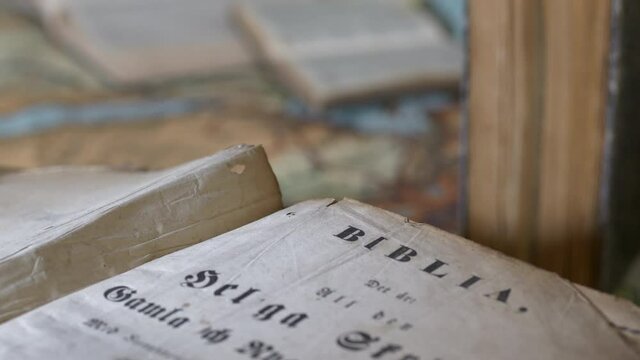 Old Christian bible and historical geographical location on Map, tilt up rack focus