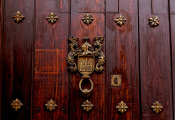  Old knocker on a colonial door in the city of Cartagena