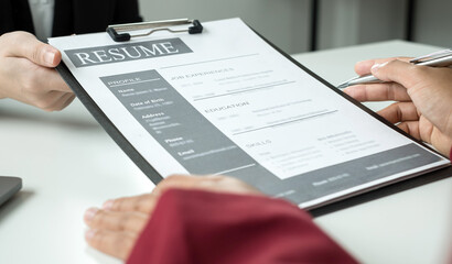 Business people hold a resume and talk to job applicants for job interviews about careers and Their...