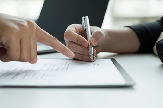 Business people hold a resume and talk to job applicants for job interviews about careers and Their personal history in the company. Recruitment concepts