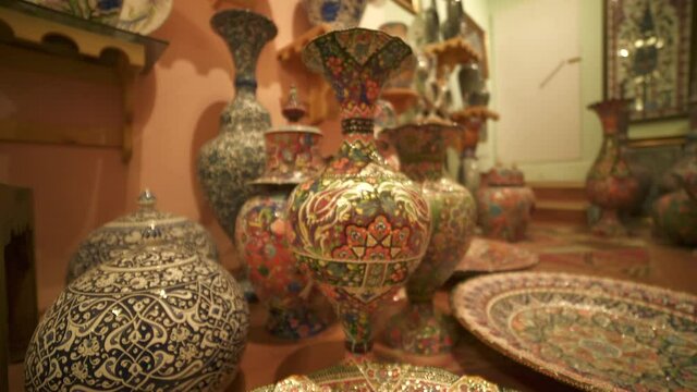 Detailed oriental floral patterns and motifs on handmade plate.Pot pottery jug crockery pitcher porcelain manual hand labor cruse fictile ware traditional art ceramic material potterywares major types