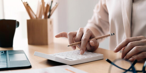 Close up view of bookkeeper or financial inspector hands making report, calculating or checking balance. Home finances, investment, economy, saving money or insurance concept