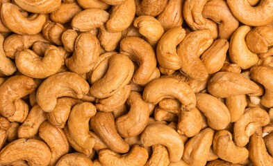 Top view roasted cashew nuts for background, close-up shot.