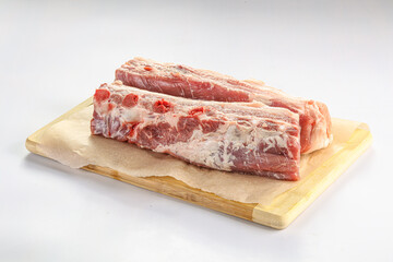 Raw pork ribs over board