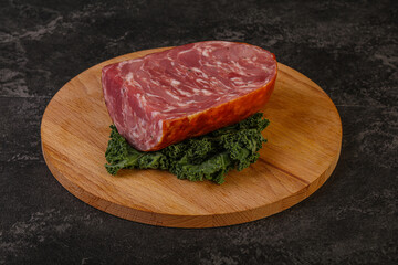 Beef ham piece over board