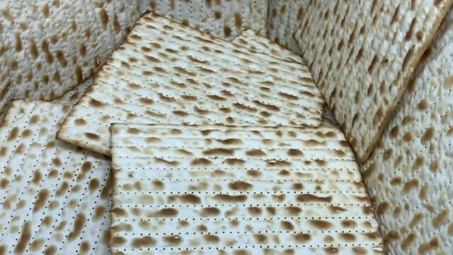 Jewish Matzah bread background. Matzah for the Jewish Passover holidays. Selective soft focus. HD