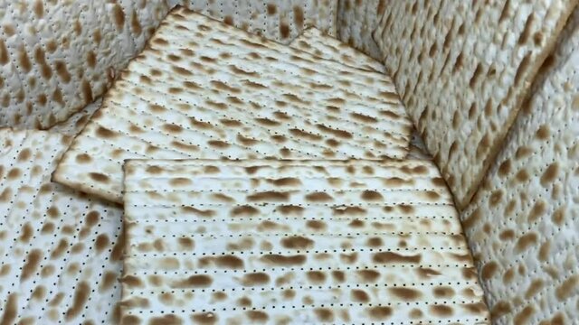 Jewish Matzah bread background. Matzah for the Jewish Passover holidays. Selective soft focus. HD