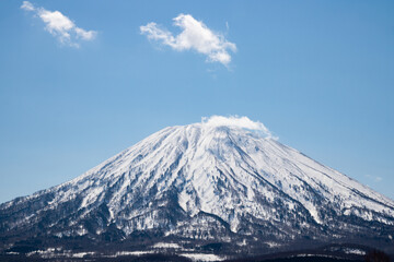 Fototapeta na wymiar Mt.Yotei covered with snow (Yezo Fuji, Makkari Nupuri, Mt.Shiribeshi)
