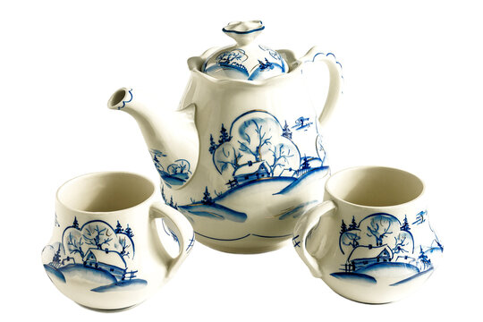 Over isolated white background stylish teapot and two cups. 
