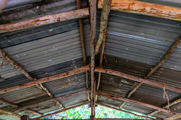 Steel roof structure. Moonlight bulb. Steel structure with roof tiles. Architectural structure of roof. Large roof layout used for industrial plants.