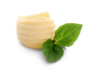 Curl of butter with basil on white background