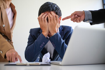 Angry boss  Bullying with an out of control boss shouting to a stressed employee. Anger issues and...