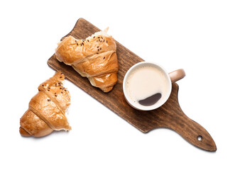 Board with cup of coffee and croissant on white background