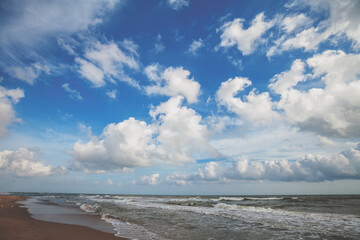 Seascape on a sunny day. Stormy sea with a beautiful cloudy sky. Nature landscape