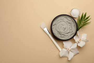 Flat lay composition with cosmetic product on beige background, space for text. Spa body wraps