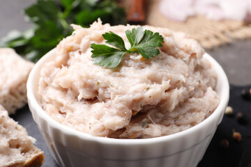 Delicious lard spread with parsley in bowl, closeup