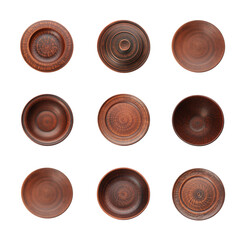 Set with clay dishes on white background, top view