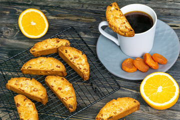 Biscotti with orange filling on a dark table