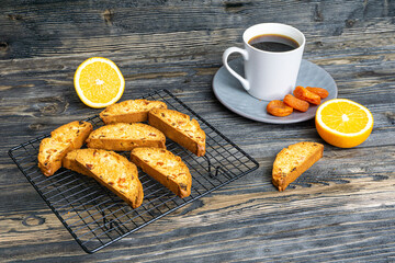 Biscotti with orange filling on a dark table