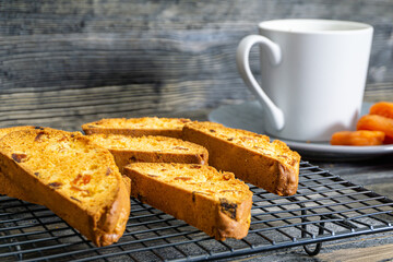 Biscotti with orange filling on a dark table