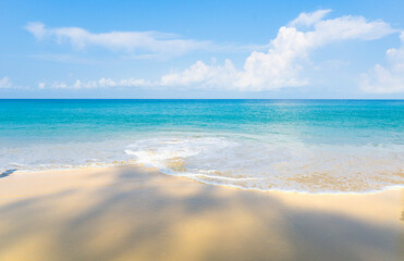 Serene and turquoise-blue sea and a white sand beach with the clear light blue sky: suitable for the summer vacation