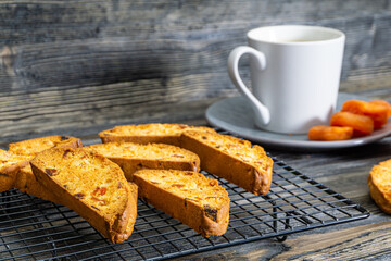 Biscotti with orange filling on a dark table