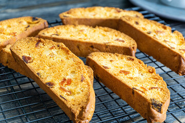 Biscotti with orange filling on a dark table