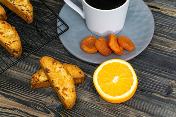 Biscotti with orange filling on a dark table