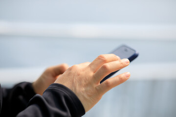 Asian woman using smartphone outdoors
