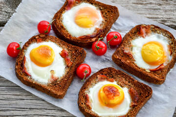 Fried egg on Wholegrain low carb  Toast with cherry tomatoes. Ketogenic  diet healty  food.Traditional French Dish Croque-Madame 