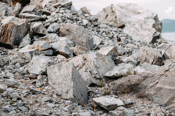 Mining process. Rocks for mining. Big gray limestone.