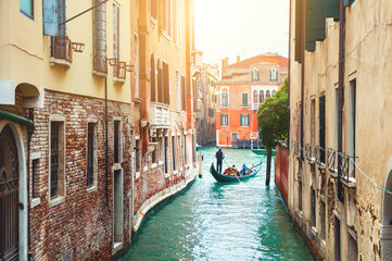 Fototapeta na wymiar Beautiful canal with old medieval architecture in Venice, Italy. View of Grand Canal and gondola. Famous travel destination