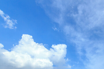 White clouds on the blue sky for background.